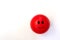 Red Smiling Emoji Ball against a White Background