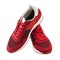 Red sneakers isolated on white background. Casual style. Red laces and white rubber sole. Fashion footwear for running