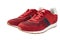 Red sneakers isolated on white background. Casual style. Red laces and white rubber sole. Fashion footwear for running