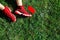 Red sneakers, phone and walkmans on pitch