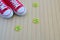 Red sneakers with spring signs on the wooden background