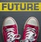 Red sneakers with words: future