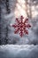 Red snowflake in a snowy environment, xmas background, christmas time