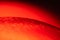 Red soap bubble with a red core like the sun and lava with red glow