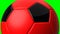 Red soccer ball on green chroma key background.
