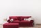 Red sofa in farmhouse interior, empty white wall mock up