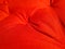 Red soft wrinkled cloth of the cushion