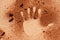 Red soil hand shape on sand like aboriginal art style