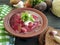 Red soup classic bowl garlic menu dinner bread delicious garlic on a black wooden background