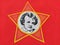 Red soviet flag with the image of young Lenin