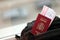 Red Spanish passport of European Union with airline tickets on touristic backpack