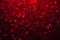 Red sparkling defocused light on black background, Red bokeh, abstract background stock photo