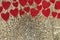 Red Sparkly Heart Confetti Framing Gold Sequin Background