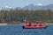 Red speedboat sailing in the sea