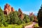 Red spike pillars of rock in park with paved winding trail