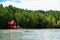 Red spirit shrine in Thailand tropical mangrove swamp forest lush evergreen river landscape