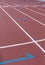 Red sport track for running on stadium starting marks. Running healthy lifestyle concept. Sports background abstract