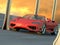 Red sports car in sunset