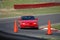 Red Sports Sedan on Race Track