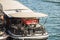 Red sportscar parked on the deck of a houseboat on the Seine, Pa