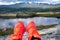 Red sporty running shoes with beautiful mountain scenery in the background