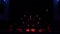 Red spotlights in the shape of a heart on an empty concert stage in the dark.