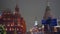 Red Square. Smooth forward movement. Kremlin clock with red star. Winter night