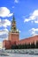 The Red Square. Spasskaya Tower of the Moscow Kremlin against the blue sky at sunset of a sunny day in late autumn. Russia.