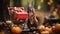 Red squirrel near a small shopping cart with nuts on the background of autumn leaves.