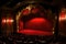 red stage closed curtain with spotlight, theater with red chairs, empty theater gold interior design