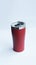 Red stainless steel tumbler and mug vacuum insulated double wall travel cup with lid isolated on white