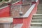 Red staircase with a fountain in the middle