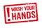 A red stamp on a white background - Wash your hands