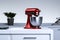 Red Stand Mixer In Modern Bright Stylish Kitchen. 3d rendering. Minimalism concept.