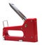 red stapler with a shiny metal handle