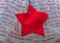 Red star in cloth sack with Christmas words. Christmas concept