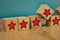 Red stars on wooden cubes on a blue background. Stars mean assessing quality. five-point rating system