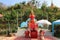 Red statue made of Thao Wessuwan cement, sacred thing at Wat Thai, Nakhon Sawan, Thailand