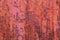 Red Steel wall rustic background with peeling paint.