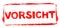 Red stencil frame: Attention banner in german language