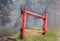 Red Stockade Fence in Forest