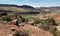 Red stone and scrub landscape at Arches NP Delicate Arch trail