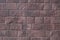 Red stone wall background, Large stone-clad facade brown color