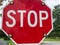 Red stop sign with flashing lights