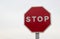 Red stop sign, isolated Traffic regulation warning sign Octagon, octagonal frame white, metal post on white background