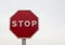 Red stop sign, isolated Traffic regulation warning sign Octagon, octagonal frame white, metal post on white background