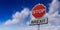 Red stop sign and text BREXIT against blue cloudy sky background. 3d illustration