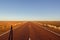 red straight road with red dessert on the Stuart Highway north of copper pedy, South Australia