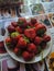 Red strawberries on the kitchen table in Kamen-na-Obi, Altai, Russia. Vertical