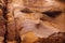 Red striped rock texture in Wadi Mujib canyon in Jordan